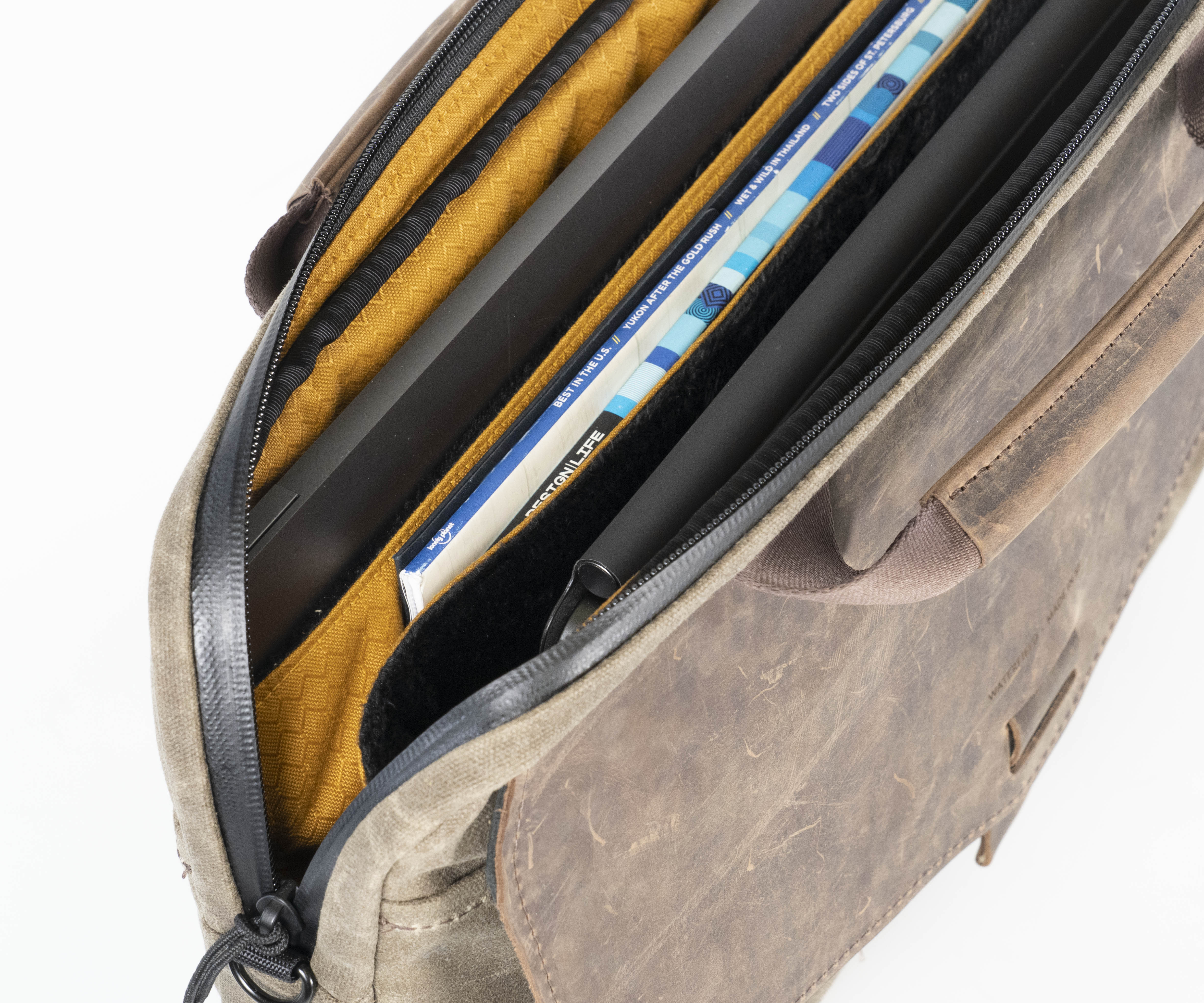 Two plush laptop compartments encased by impact-resistant foam, lined no-scratch fabric.