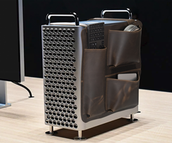 The Leather Mac Pro Saddle — a full-grain leather Mac Pro accessory case that drapes over the Mac Pro to centrally organize the suite of multi-sized devices power users rely on