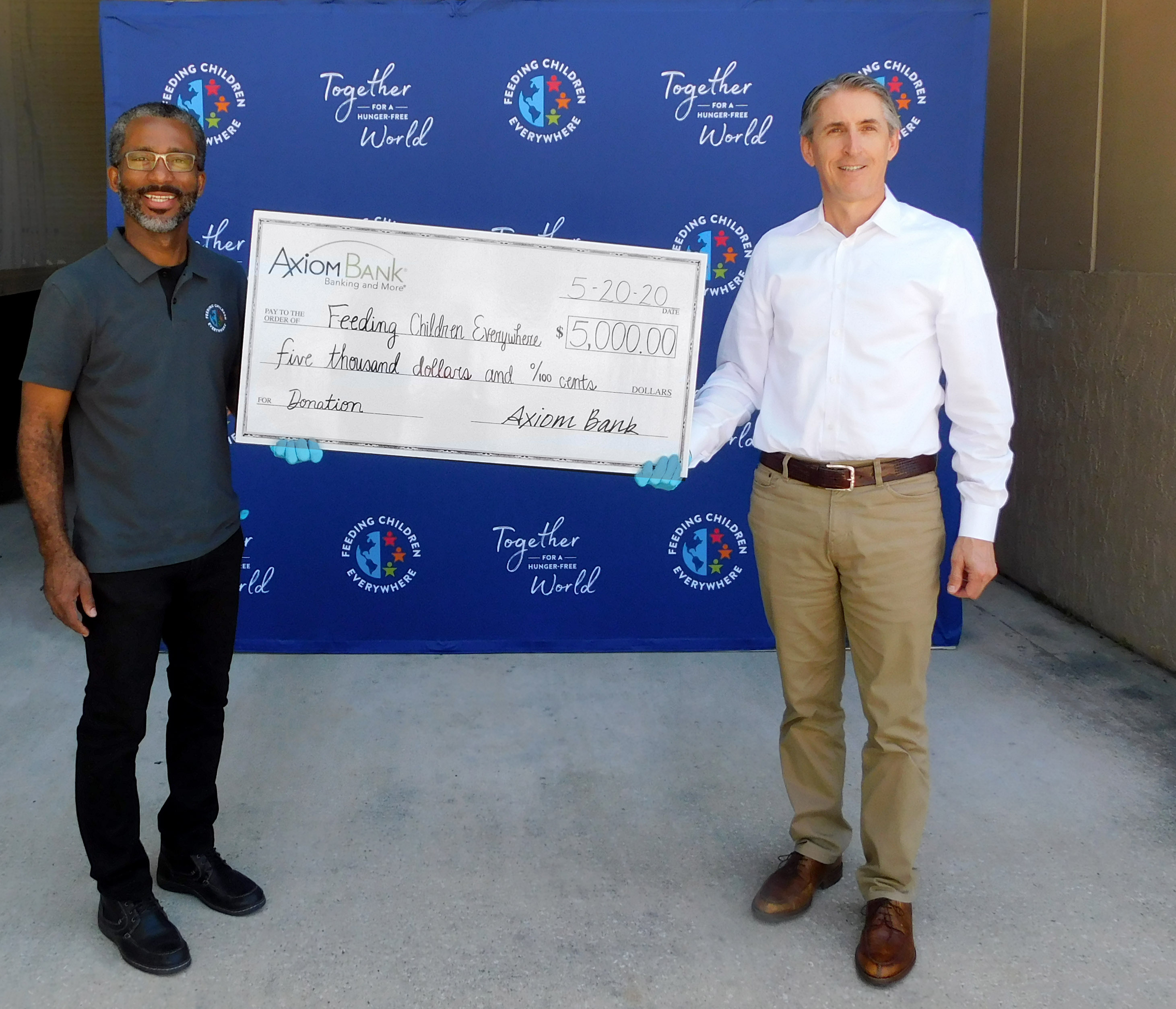 Dan Davis presenting check to Rick Whitted