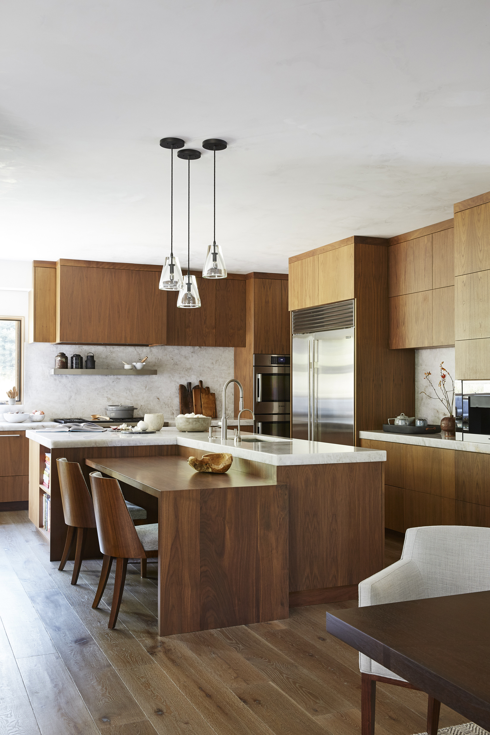 A Jackson Hole kitchen by WRJ Design, featured in the new book “The Perfect Kitchen,” uses clean lines and natural wood to create harmony in a busy family space (photo by William Abranowicz).