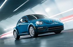 2019 Volkswagen Beetle blue driving fast in tunnel
