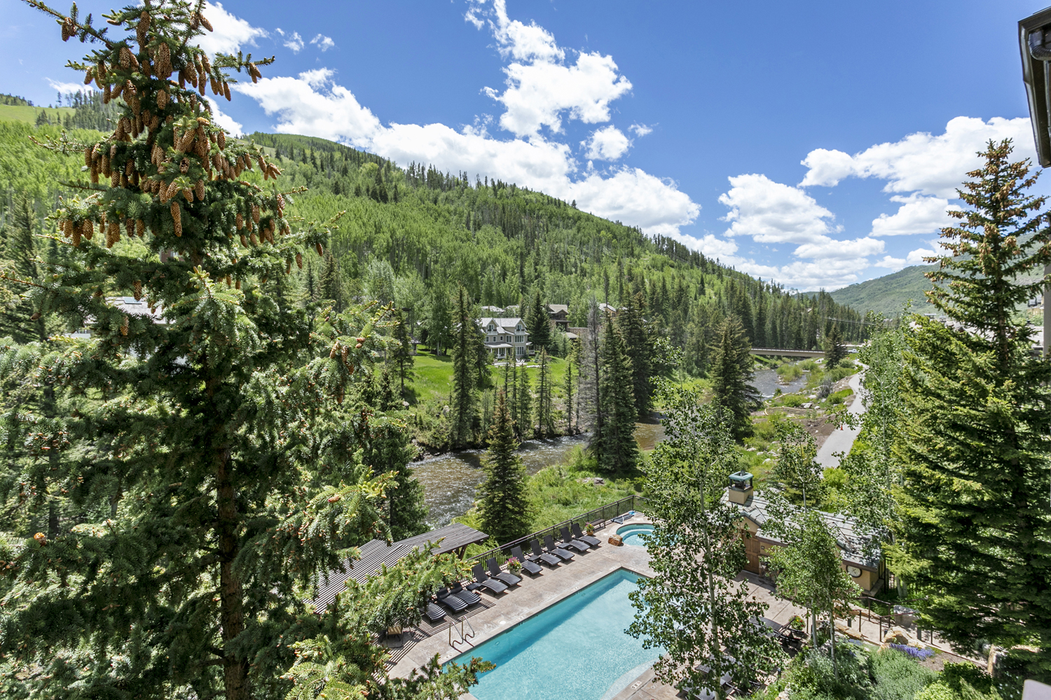 The Antlers at Vail creek-side year-round pool and hot tubs give guests the chance to cool off and enjoy the view.