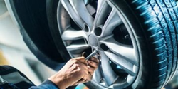 Image of a service technician filling up a Tire with Nitrogen