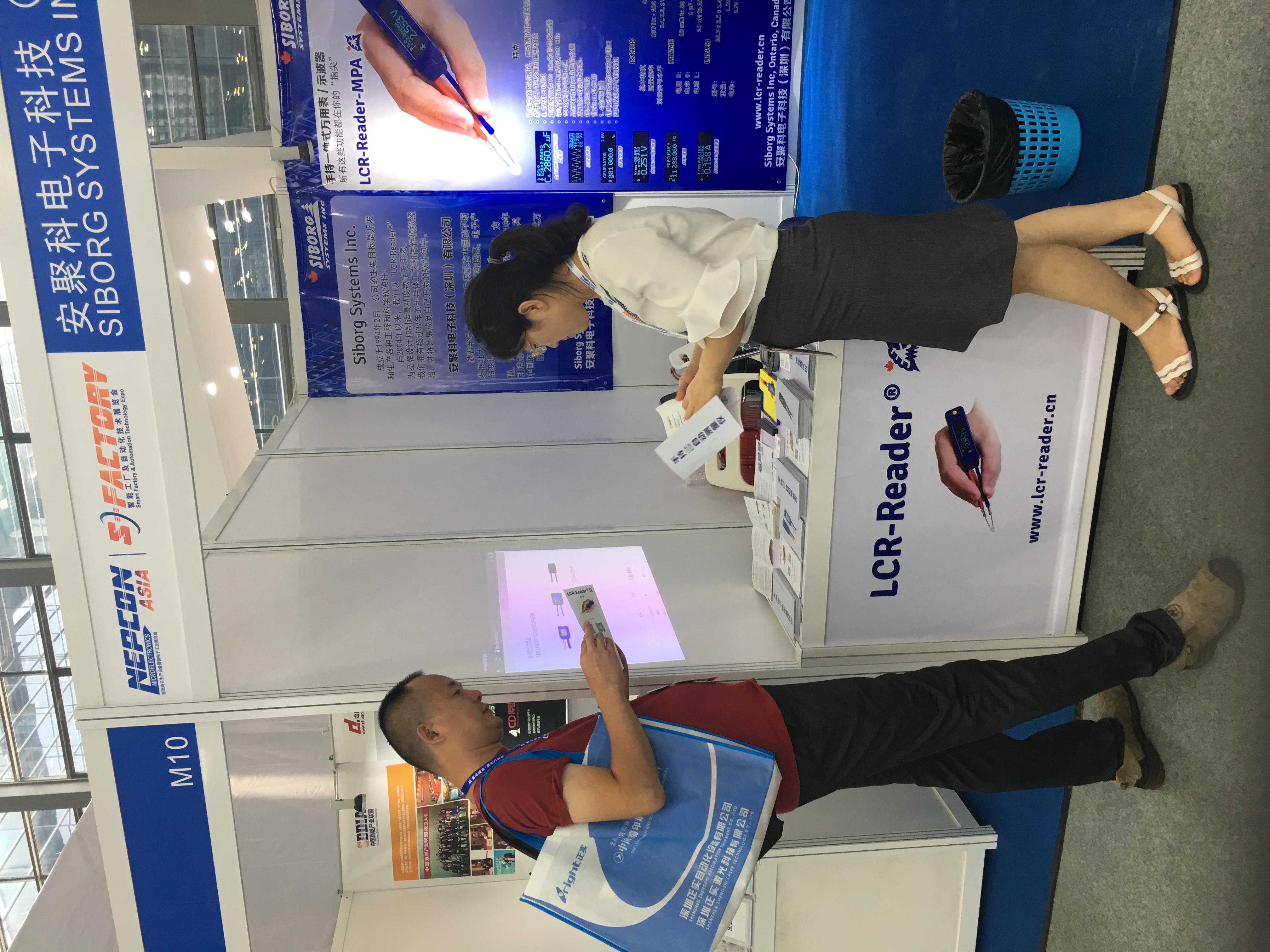 A visitor learns about LCR-Reader-MPA at Nepcon Asia