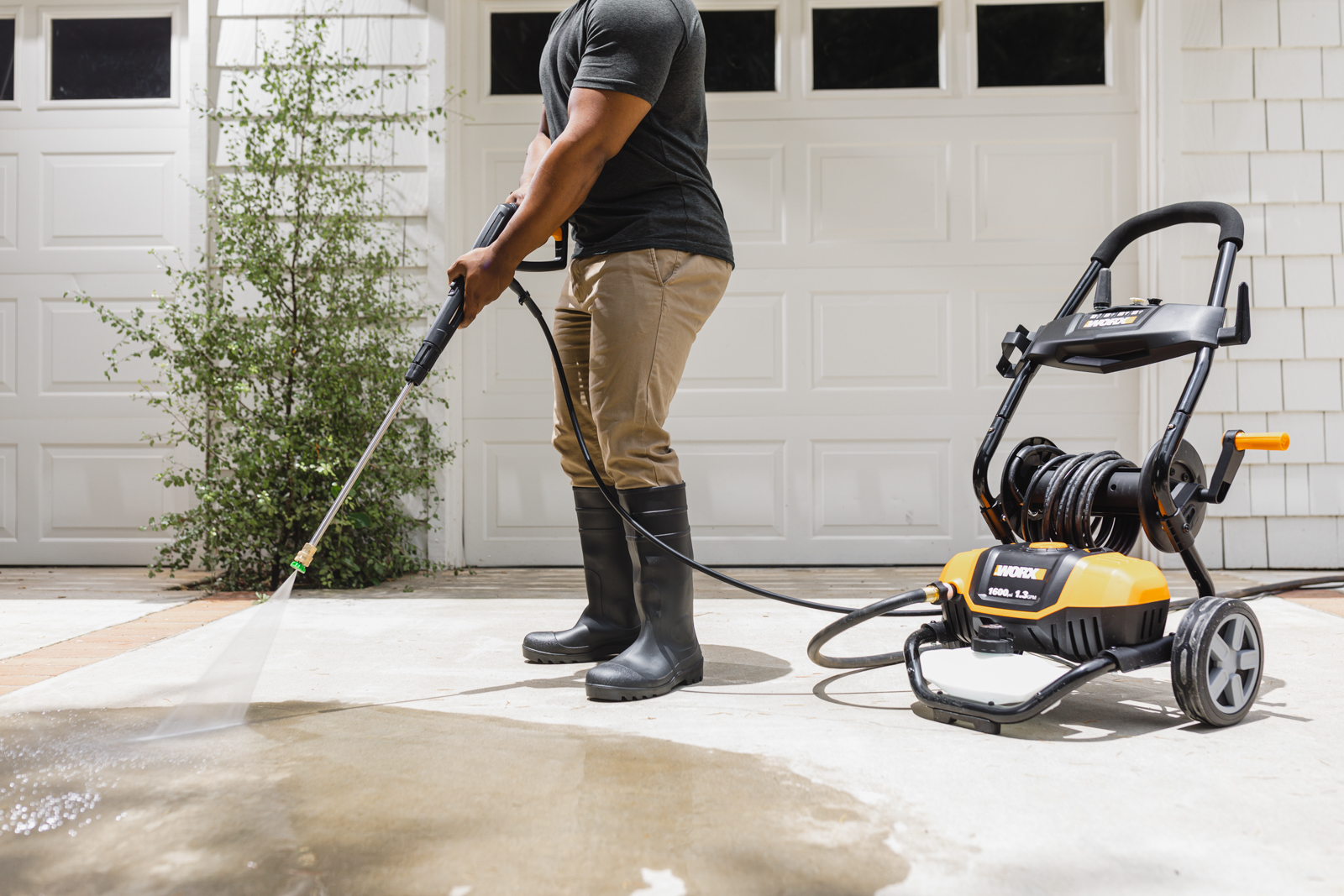 WORX 1600 psi Electric Pressure Washer cleans driveway