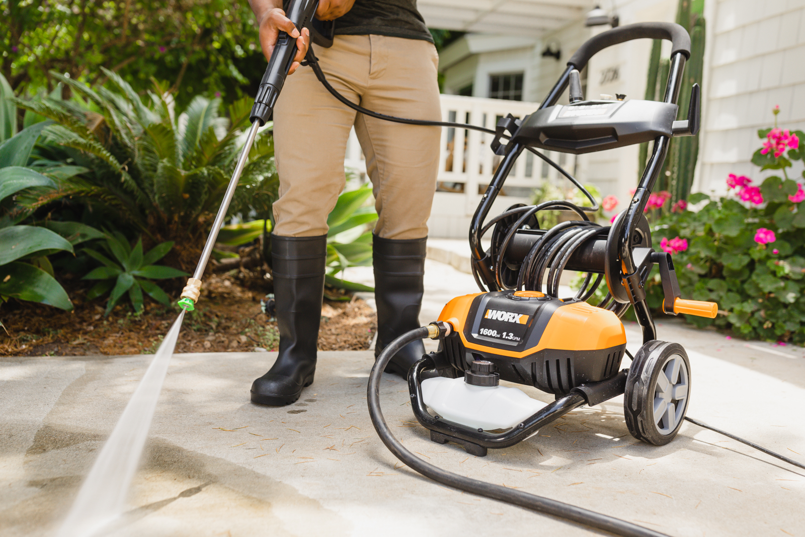 WORX 1600 psi Electric Pressure Washer cleans walkway