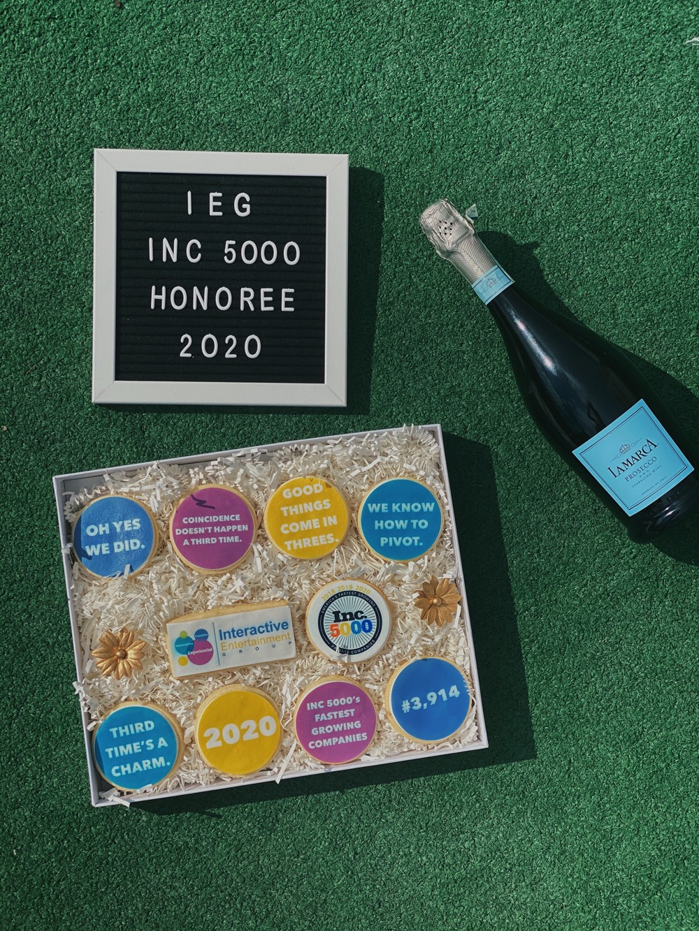 IEG celebrates the honor with cookies and champagne.