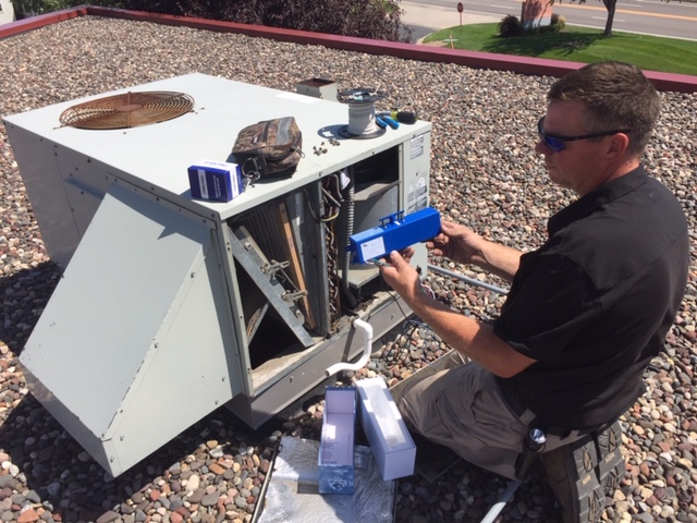 Technician Installing a Bi-Polar Ionization system to a Johnstech HVAC unit