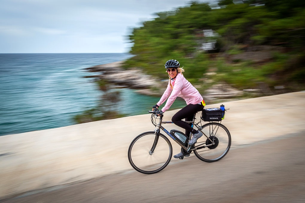 Backroads guest enjoying an E-bike ride on a Dolce Tempo journey