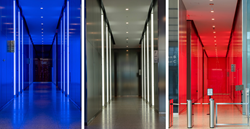 the lobby of 3 World Trade Center is shining in red, white and blue thanks to a customized lighting solution created by Apogee Lighting