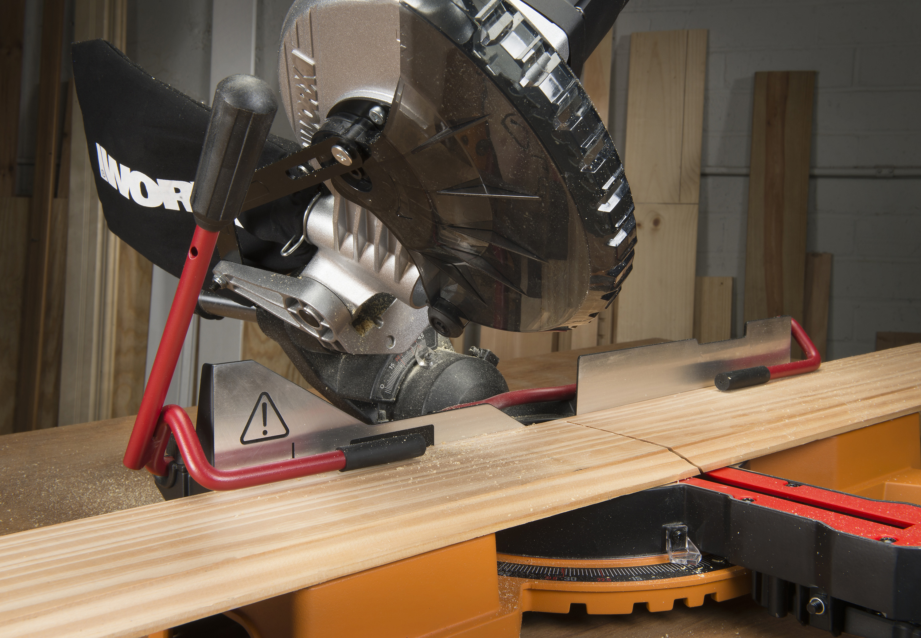 WORX 20V Power Share 7 ¼ in. Sliding Compound Miter Saw has built-in, hold-down lever that secures material throughout the cut, keeping hands away from blade.
