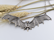 A wing spreaded bat necklace that's perfect for decorating a Halloween party or costume this 31st.