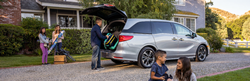 2021 Honda Odyssey Exterior Passenger Side Rear Profile Surrounded by Family