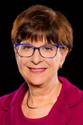 Head shot of Elaine Katz against a black background