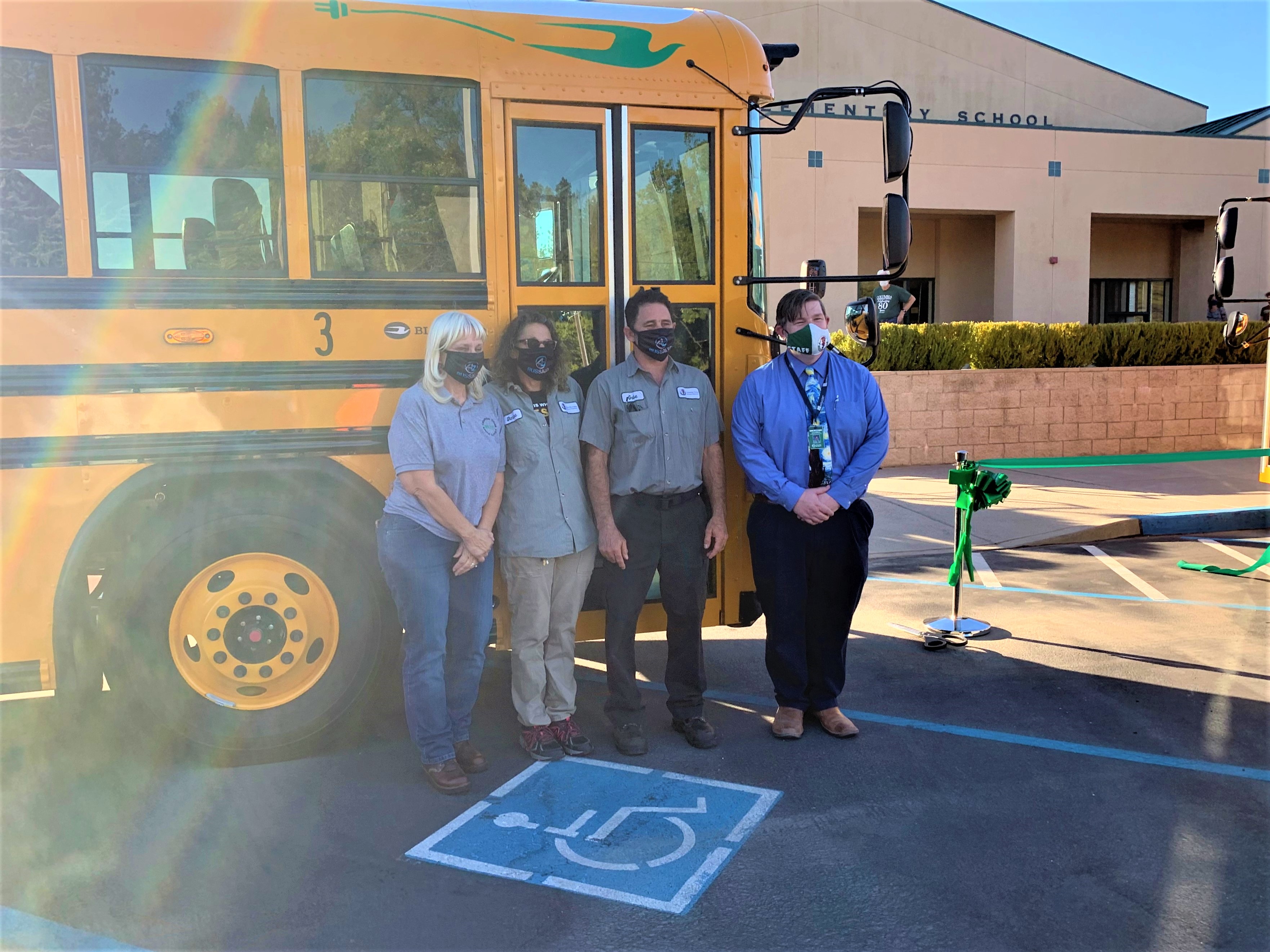 Columbia USD staff celebrating their new Blue Bird All-Electric buses delivered by A-Z Bus Sales