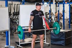 Adaptive Athlete Logan Aldridge lifting weights