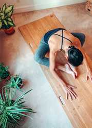 The Root Board being used by yoga practitioner