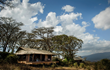 Nomad Tanzania’s Entamanu Ngorongoro showcases unmatched vistas of both the Crater floor sunrises and Serengeti sunsets.