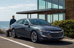 2020 Chevrolet Malibu parked outside of a glass building