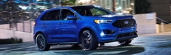 side view of a blue 2021 Ford Edge