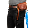 Wag Hip Pack in cognac — exterior straps hold a leash and fetch toy