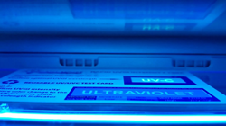 QuantaDose UVC Test Card inside a Phone Soap UV Phone Sanitizer