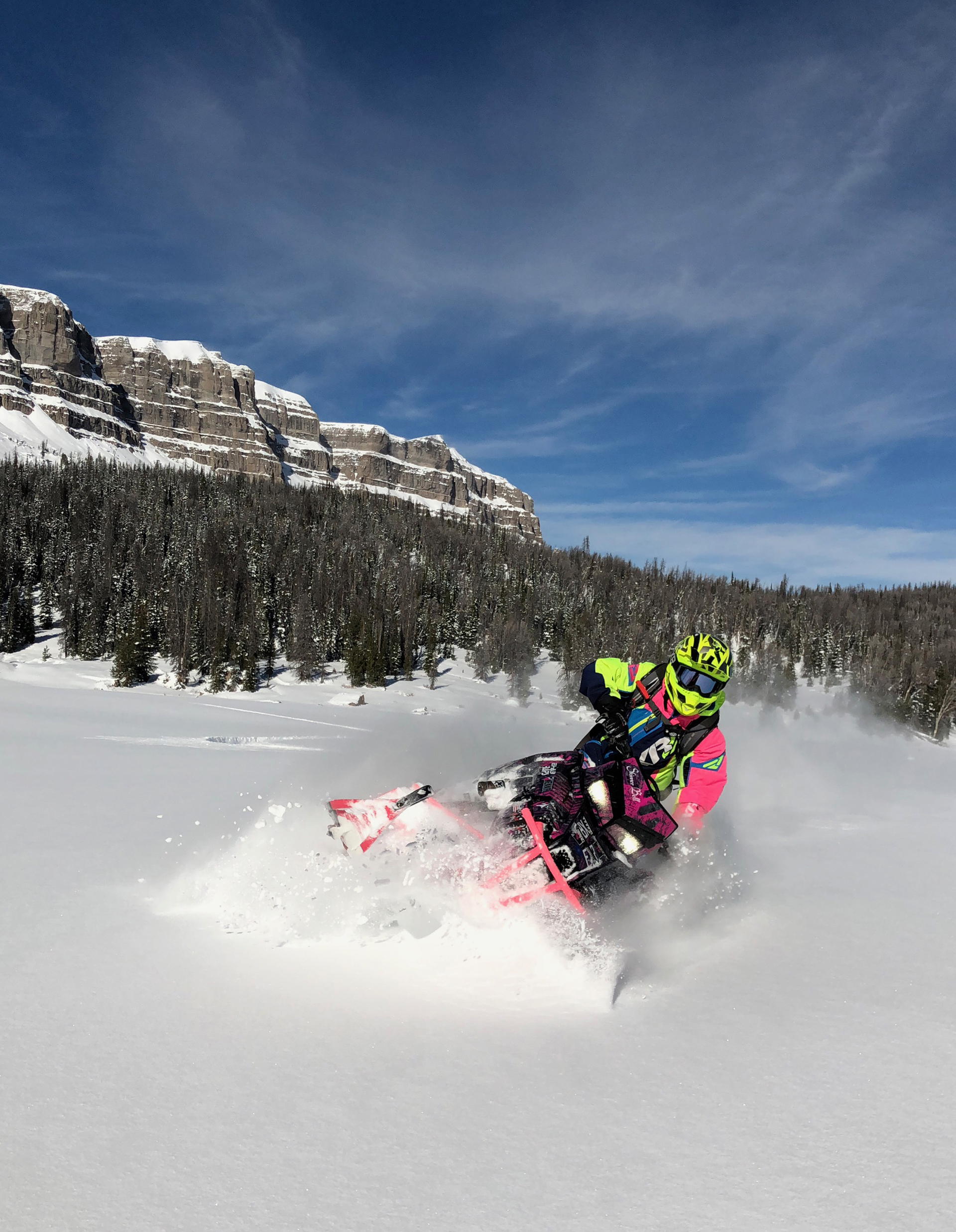 Snowmobilers enjoy the 2 million acres of scenic Shoshone National Forest backcountry riding and 600 miles of groomed trails surrounding Brooks Lake Lodge.