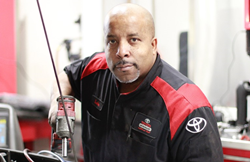 A Toyota of Puyallup service technician looking at the camera.