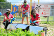 The nonprofit The Education Fund in Miami-Dade County harvests fresh produce from its food forest at Fienberg-Fisher K-8 on Miami Beach for delivery by self-driving test vehicles.