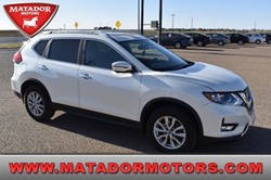 The front and side view of a white 2017 Nissan Rogue with the Matador Motors logo and the website title at the bottom.