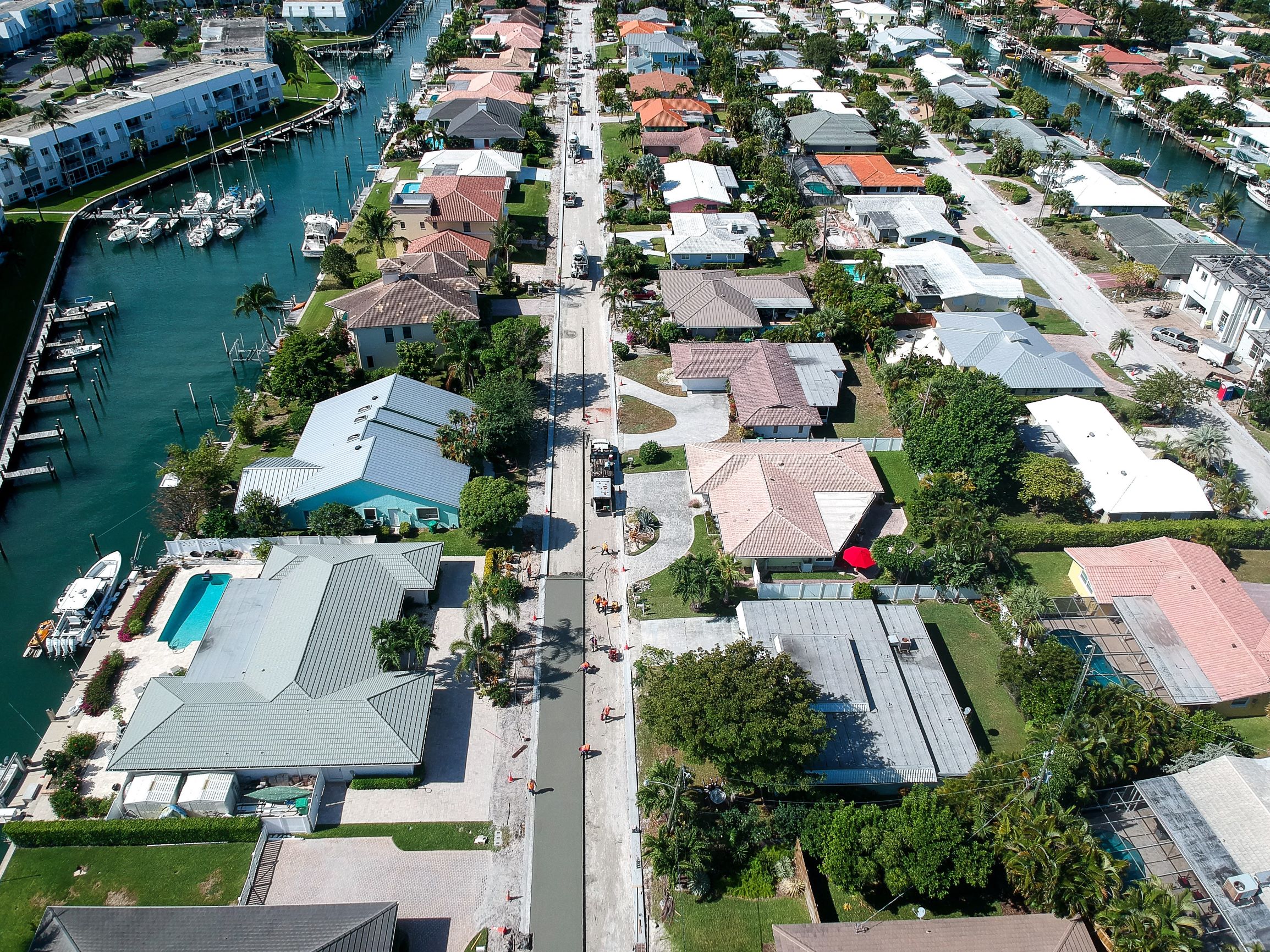 Workers repave the roads with concrete in the neighborhood of Yacht Harbor Manor as part of the recent Singer Island Neighborhood Improvement Project.