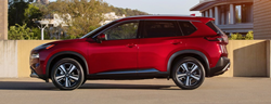 Side view of 2021 Nissan Rogue color red