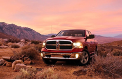 2020 Ram 1500 Classic red paint parked in desert headlights with pink sky