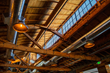 The 13,000-square-foot space has been completely renovated, while keeping previously hidden historic details including original 25-foot high-vaulted wood ceilings and windows.