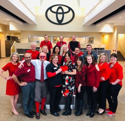 A group of Toyota of Puyallup staff wearing red for National Wear Red Day.