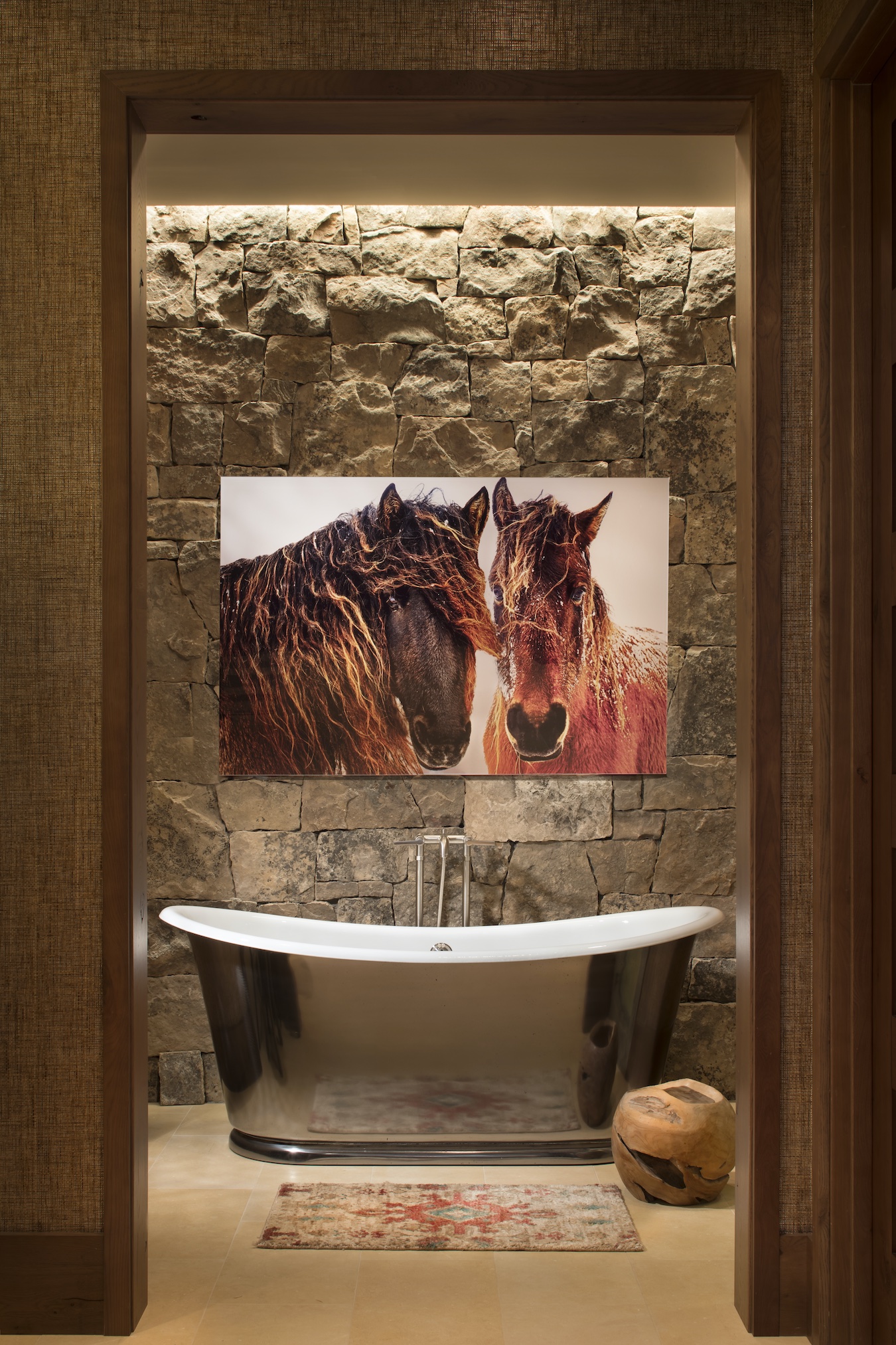 Mountain Living magazine highlighted Courtney St. John’s design of a Beaver Creek, Colorado, bathroom combining moss rock, fine art and a nickel-finished Waterworks tub (photo by Gibeon Photography).