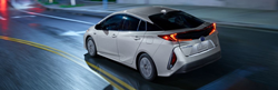 2021 Prius Prime driving down the street