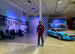 the K1 Speed Oxford lobby featuring Aston Martin car and podium