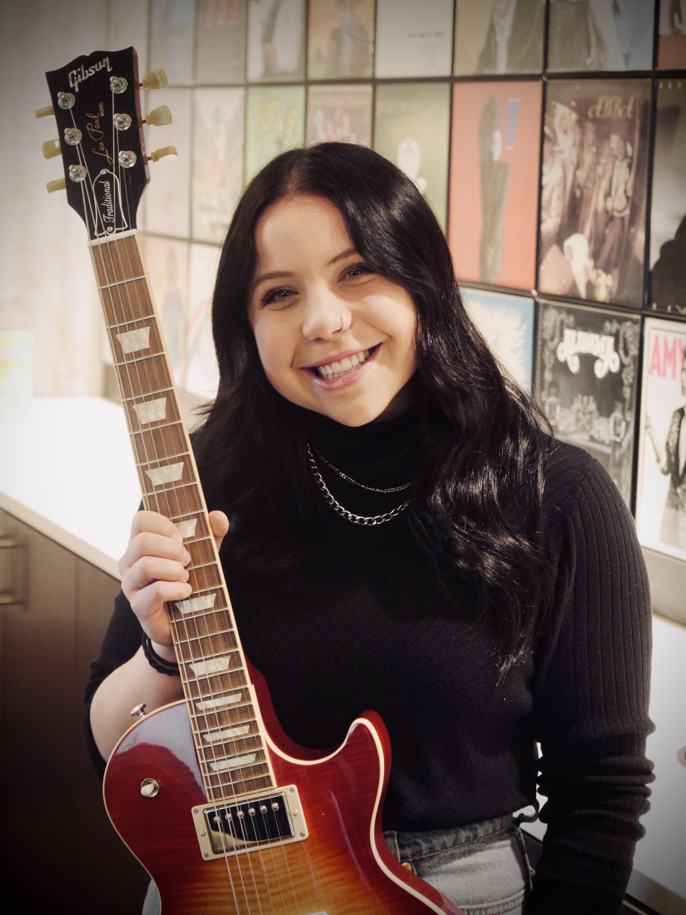 Abigail Orsborn poses with her new Gibson Les Paul guitar, courtesy Gibson Gives, the charitable arm of Gibson guitars. (Photo: Man of War Creative Studios)