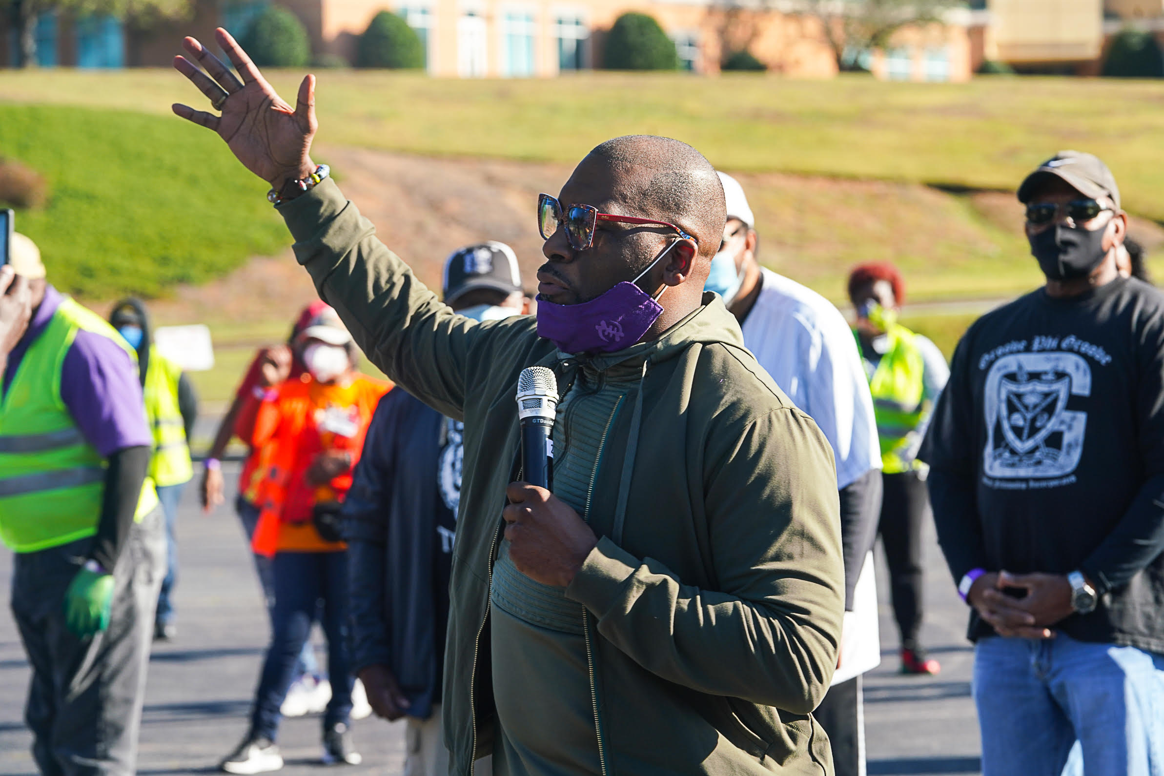 New Birth Missionary Baptist Church Senior Pastor Dr. Jamal Harrison Bryant addresses volunteers participating in the weekly food distribution.
