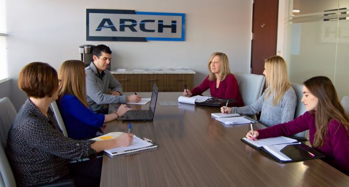 Leann Gurley (back, right) discusses policy and procedures with the ARCH Cutting Tools HR team.