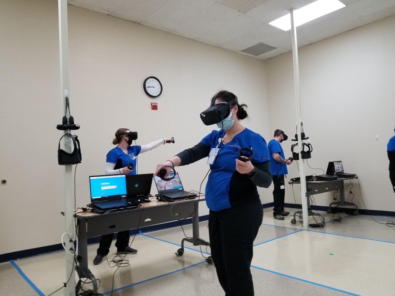 Students participating in a virtual immersive reality lab at Brookline College.