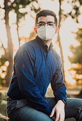 business man with a fit white ora disposable nano mask while wearing glasses