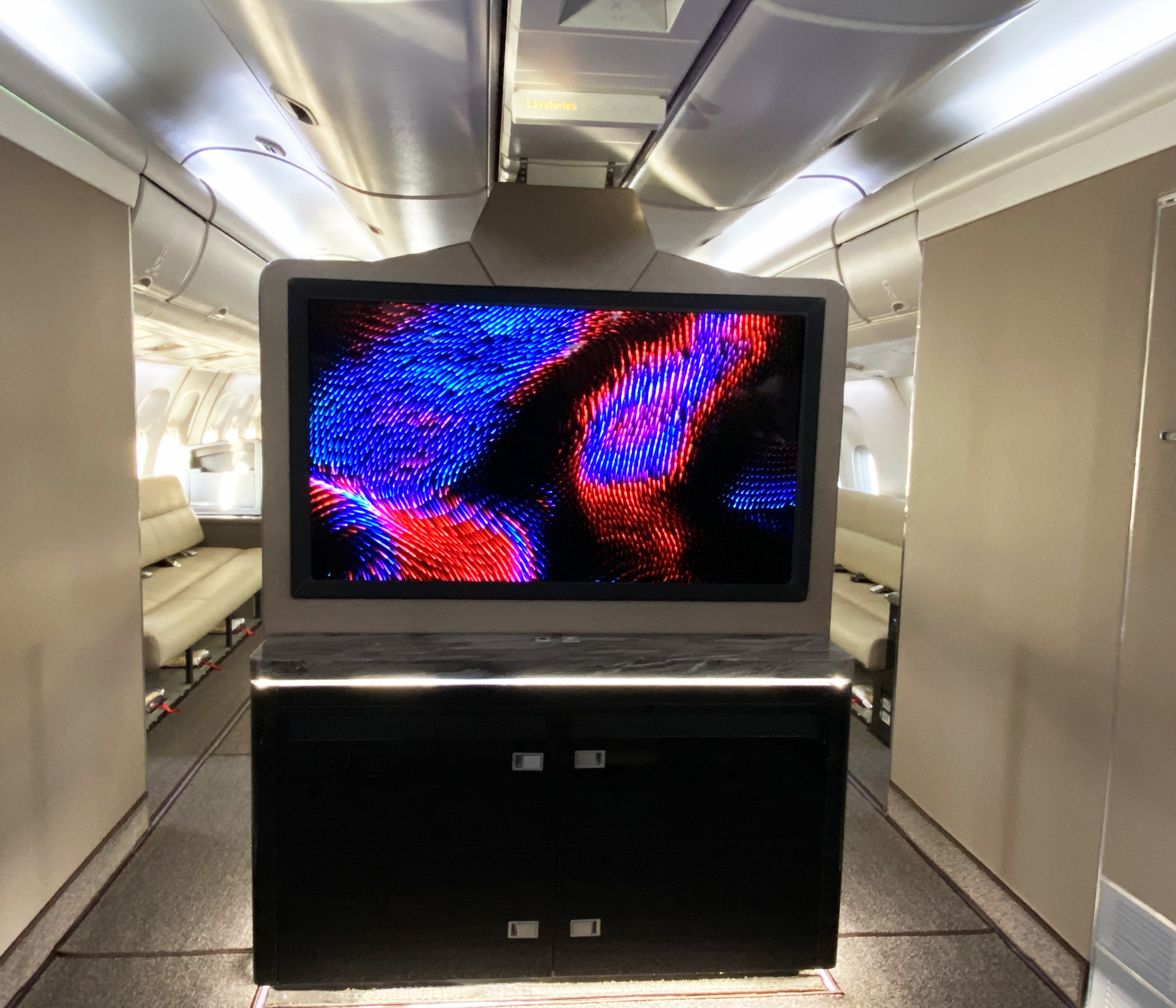 DPI Labs SmartCanvas 55" OLED UHD 4K cab display shown here installed on a Boeing 767.
