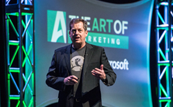 John Jantsch, Founder of Duct Tape Marketing, on stage and speaking at an event.