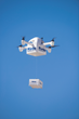 A Flirtey Eagle unmanned aircraft is shown in flight making a medical delivery.