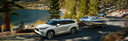 2021 Toyota Highlander towing a boat