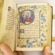 A MINIATURE ILLUMINATED MANUSCRIPT BOOK OF HOURS ON VELLUM IN LATIN AND DUTCH, WITH 19 CHARMING HISTORIATED INITIALS