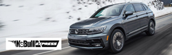 Blue 2021 Volkswagen Tiguan on a Snowy Road with Earnhardt VW No Bull Express Logo