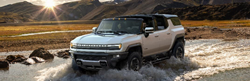 2024 GMC HUMMER EV SUV Exterior Driver Side Front Profile Fording through Water